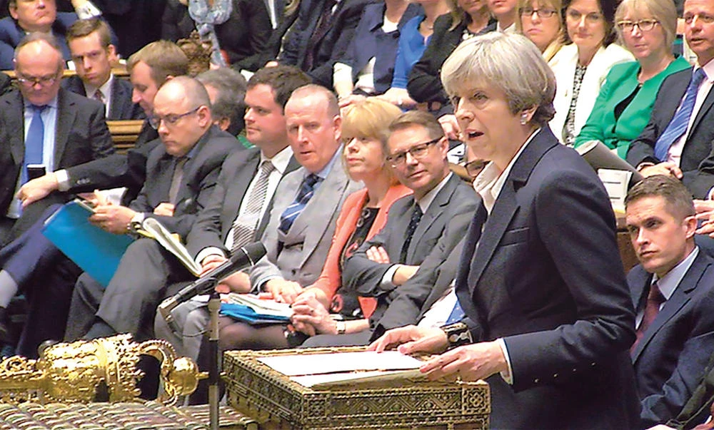 Britain’s Prime Minister Theresa May speaks in Parliament as she announces that she has sent the letter to trigger the process of leaving the
EU in London, on Wednesday. (Reuters)