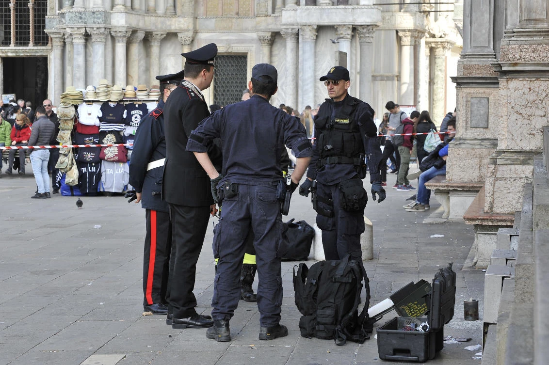 Italian Police and Carabinieri officers stands in St. Mark Square in Venice, Italy, Friday, March 17, 2017. (AP)
