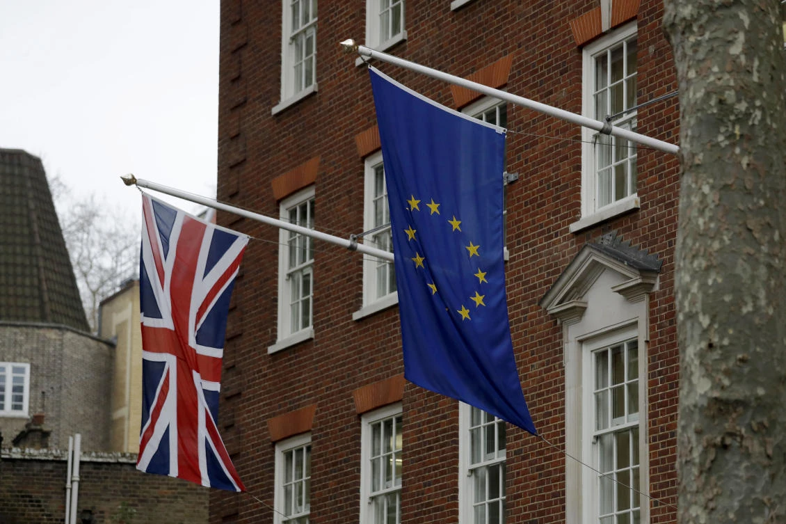 A European and British Union flags hang outside Europe House, the European Parliament's British offices in London. (AP Photo/Matt Dunham)