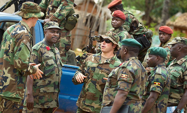 US Army special forces members speak with troops from the Central African Republic and Uganda, in Obo, Central African Republic. (AP)