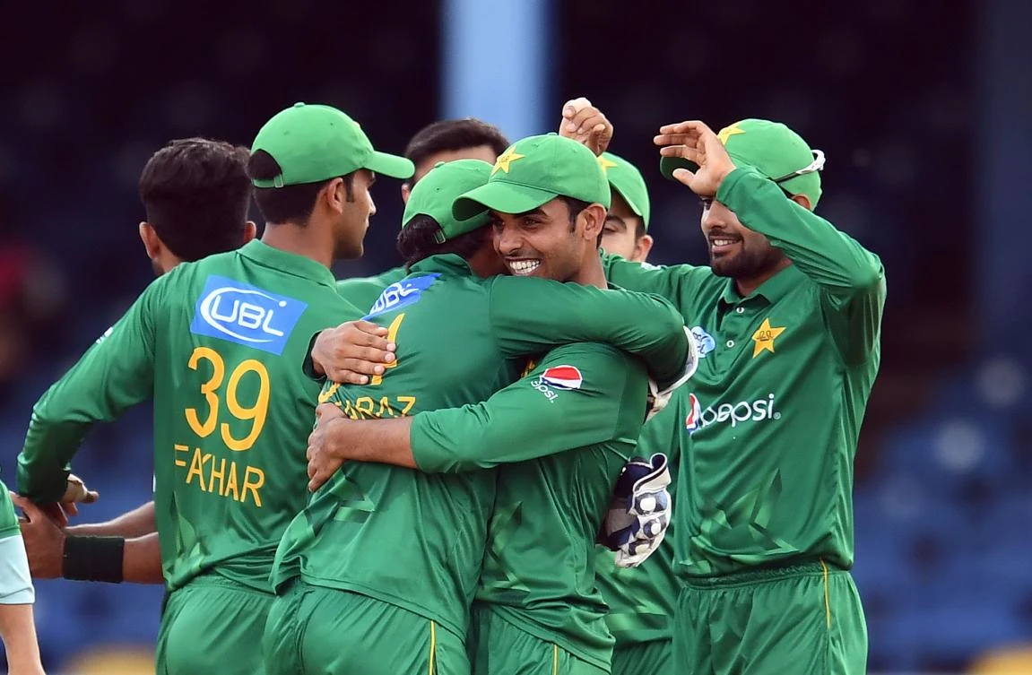 Pakistan's Shadab Khan, right, embraces Sarfraz Ahmed as they celebrate their victory over West Indies at the Queen's Park Oval in Port of Spain, Trinidad, on Thursday night. (AFP)