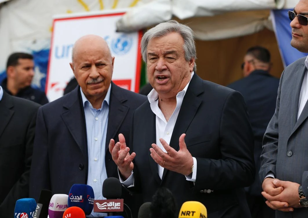UN Secretary-General Antonio Guterres (C) delivers a speech at the Hasan Sham camp. (AFP)