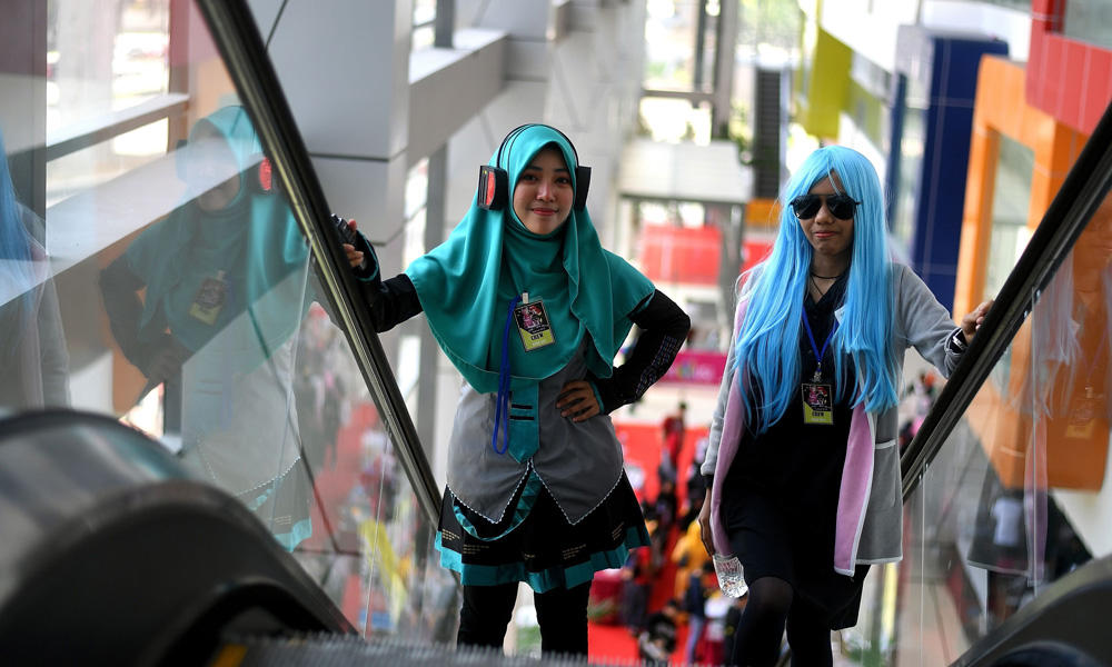 Cosplay enthusiasts take part in the "Hijab Cosplay" event in Subang Jaya, outside of Kuala Lumpur, on Saturday. (AFP / Manan Vatsyayana)