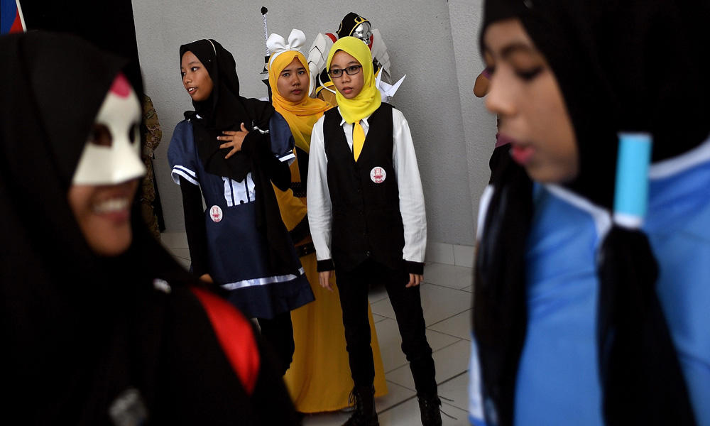 Muslim cosplay enthusiasts take part in the "Hijab Cosplay" event in Subang Jaya, outside of Kuala Lumpur, on Saturday. (AFP / Manan Vatsyayana)