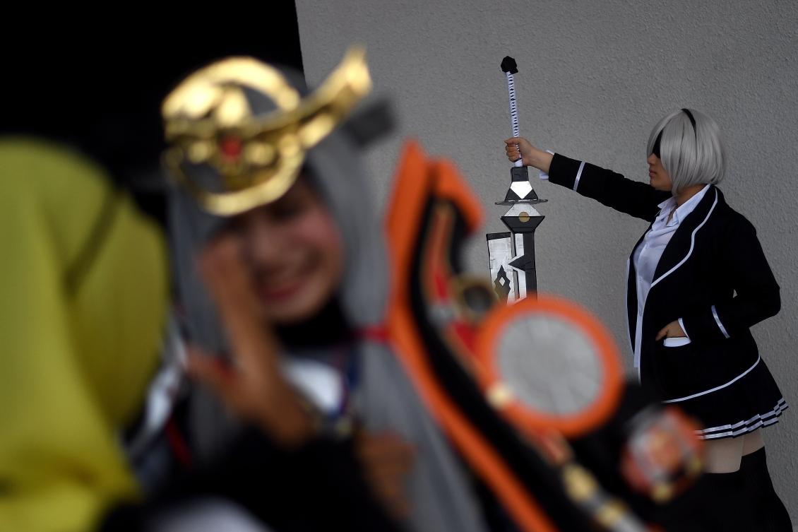 A cosplay enthusiast waits during the "Hijab Cosplay" event in Subang Jaya, outside of Kuala Lumpur, on Saturday. (AFP / Manan Vatsyayana)