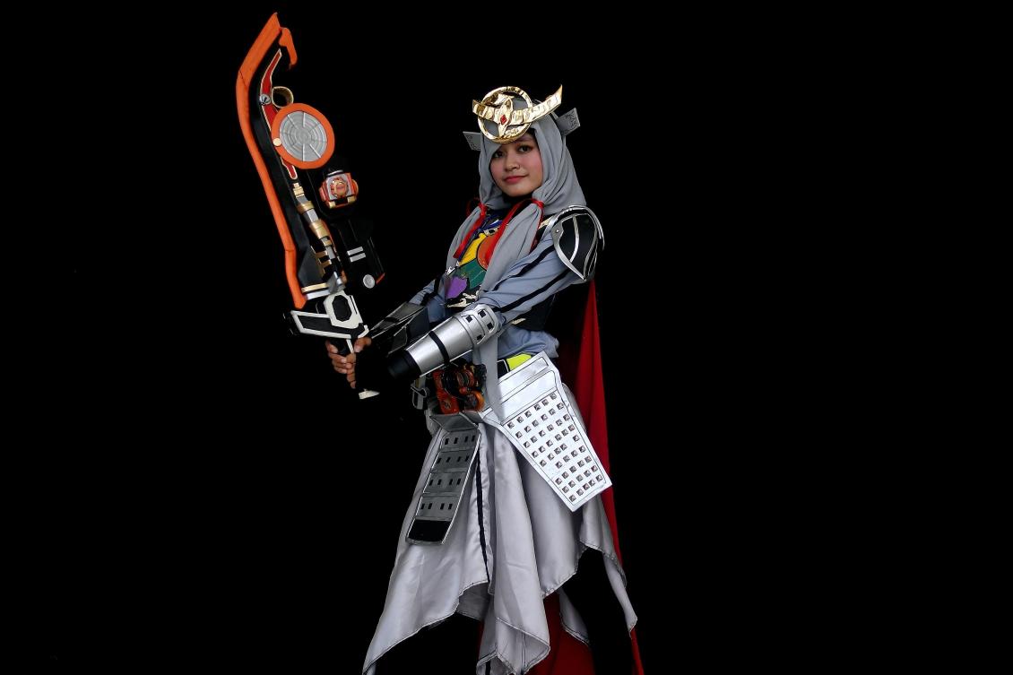 Ange, a young Indonesian Muslim cosplayer dressed as the Kamen rider Gaim, takes part in the "Hijab Cosplay" event in Subang Jaya, outside of Kuala Lumpur, on Saturday. (AFP / Manan Vatsyayana)