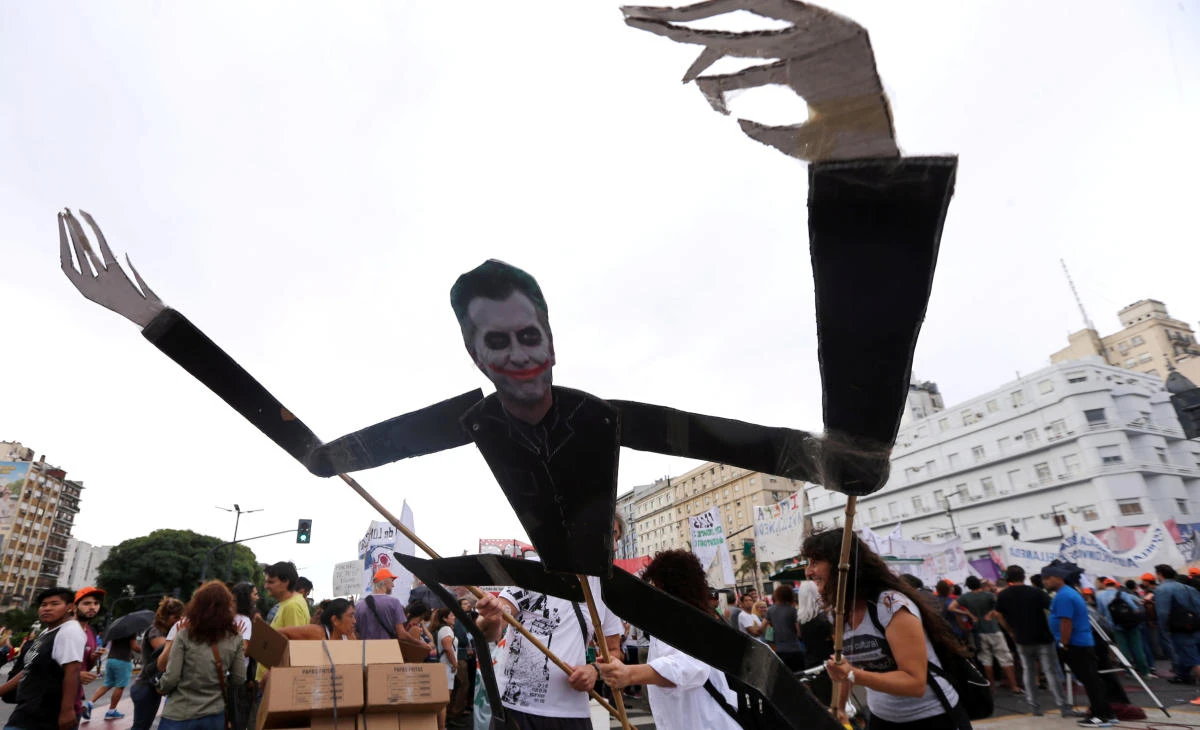 Demonstrators hold a figure depicting Argentina's President Mauricio Macri during a protest against the government's policies as part of a 24-hour strike. (Reuters)