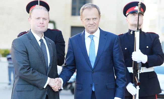 The President of the European Council Donald Tusk (R) is welcomed by Malta's Prime Minister Joseph Muscat as he arrives to give a press conference on Friday in St Julian’s Malta. (AFP)