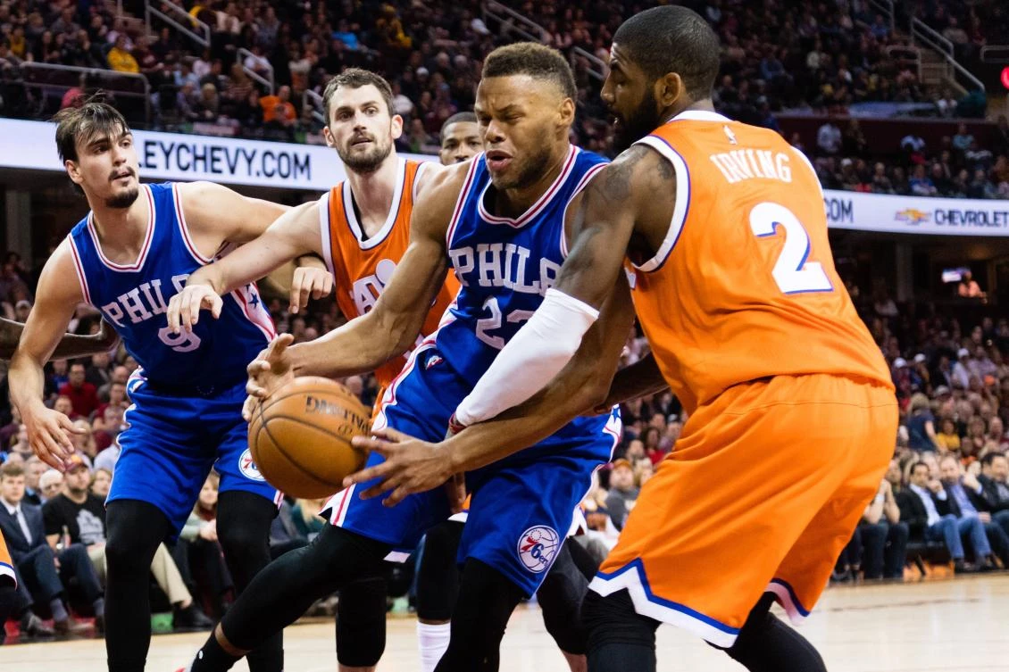Richaun Holmes (22) of the Philadelphia 76ers tries to drive around Kyrie Irving (2) of the Cleveland Cavaliers during the first half at Quicken Loans Arena in Cleveland, Ohio, on Friday night. (AFP)