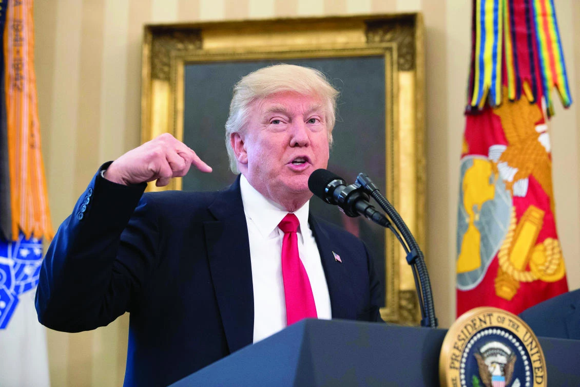 President Donald Trump speaks during a signing ceremony for executive orders regarding trade
in the Oval Office at the White House on Friday. (AP)