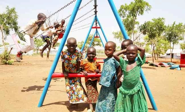 In this March 14, 2017 photo, South Sudanese refugee children play outside a temporary school in Bidi Bidi camp, northern Uganda. (AP)
