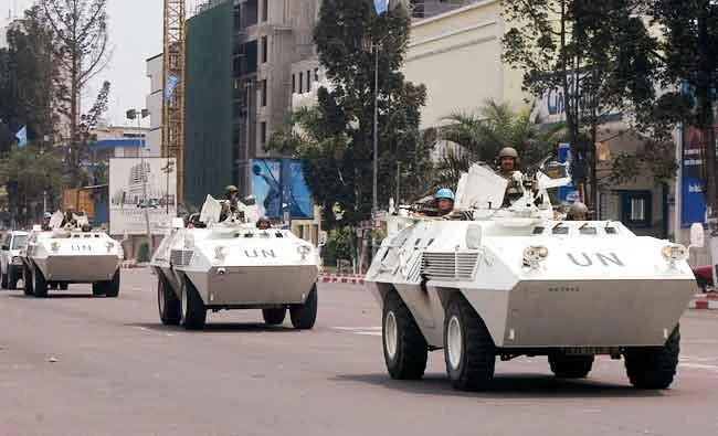 In this Aug. 21, 2006 file photo, UN troops in armored vehicles drive through the streets of Kinshasa, Congo. (AP)