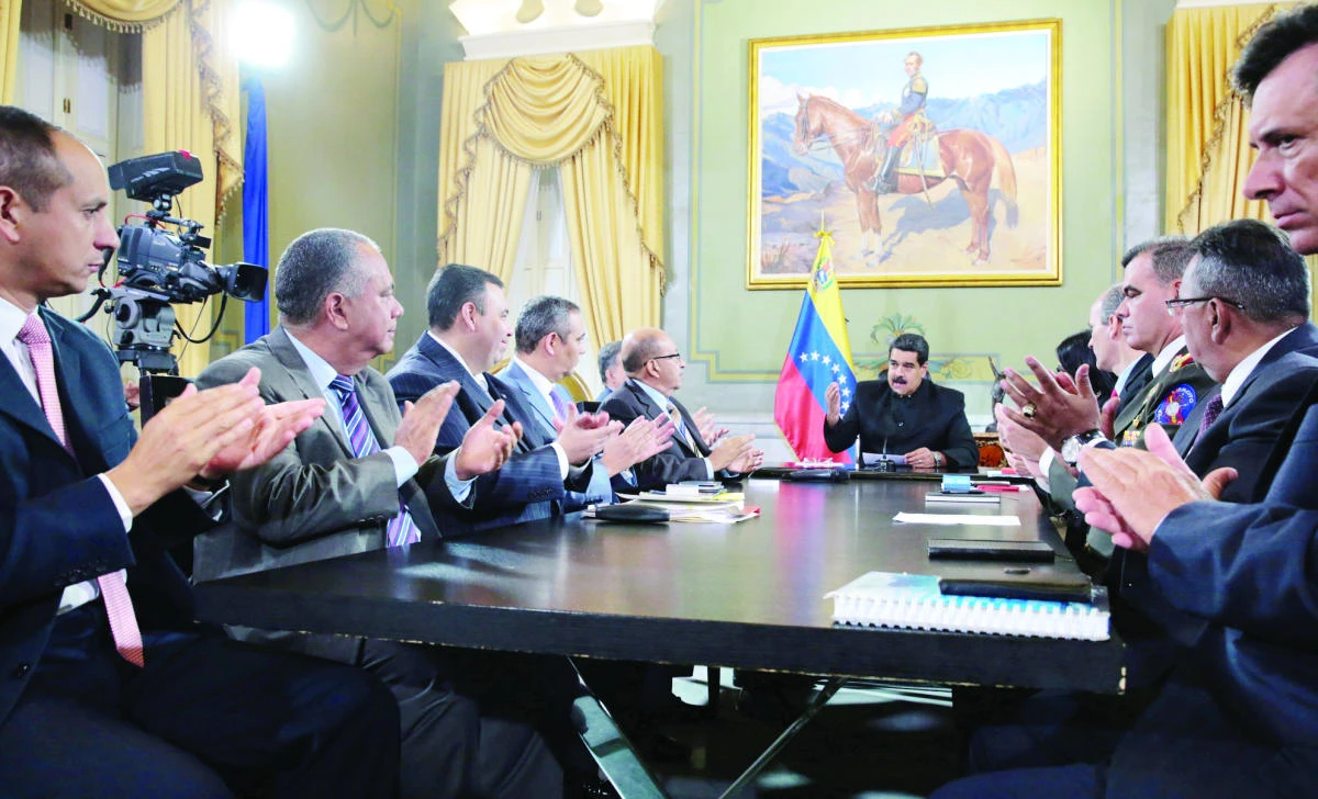 Venezuela’s President Nicolas Maduro, center, speaks during a meeting with ministers and other Venezuelan authorities at Miraflores Palace in Caracas, Venezuela, on Saturday. (Reuters)
