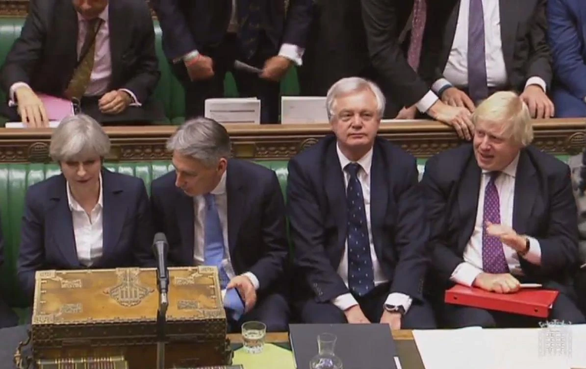 The British Prime Minister Theresa May , British Chancellor of the Exchequer Philip Hammond , British Secretary of State for Exiting the European Union. (AFP Photo)