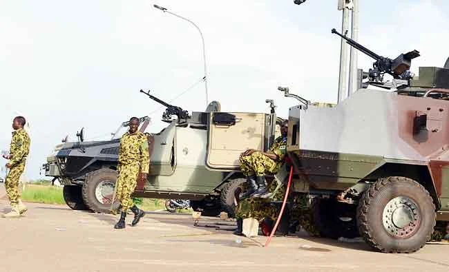Militaries stand next to vehicles on September 17, 2015 in Ouagadougou. (AFP)