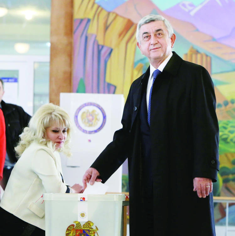 Armenia's President Serzh Sarksyan casts his ballot during a parliamentary election in Yerevan, Armenia, on Sunday. (Reuters)