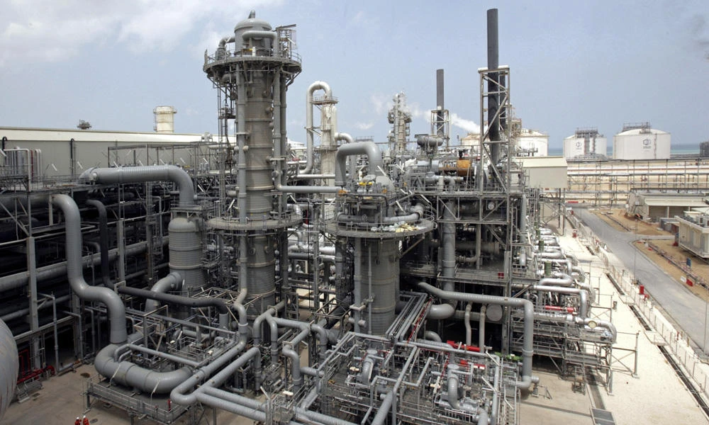 A gas production facility is seen at Ras Laffan, Qatar. State-run Qatar Petroleum said Monday that it plans to boost production from a vast underwater natural gas field by 10 percent giving it the capacity to export some 2 billion cubic feet of gas per day from the North Field. (AP Photos/Maneesh Bakshi, File)