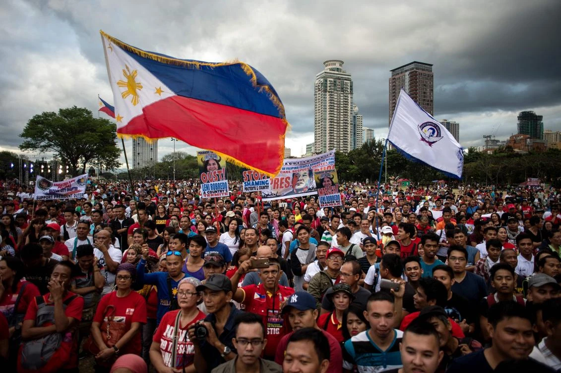 Supporters of Philippine President Rodrigo Duterte hold a protest calling for the ouster of Vice President Leni Robredo. (AFP)