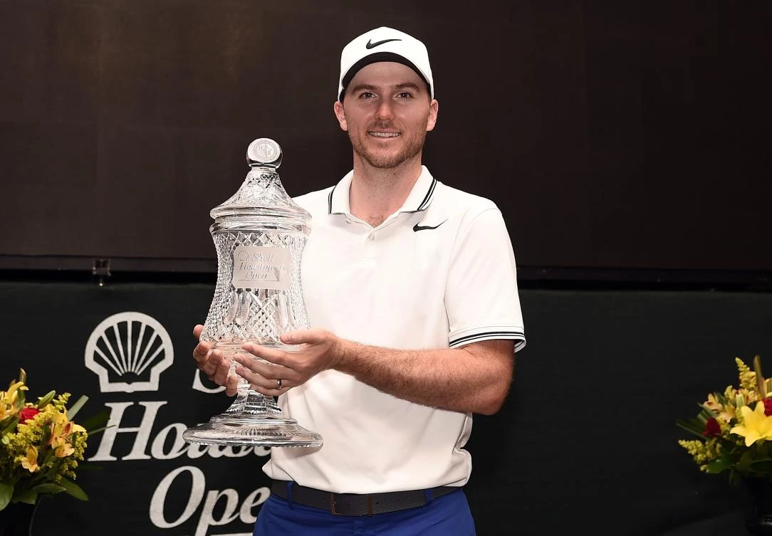 Russell Henley with the trophy after winning the Shell Houston Open at the Golf Club of Houston on Sunday in Humble, Texas. (AFP)