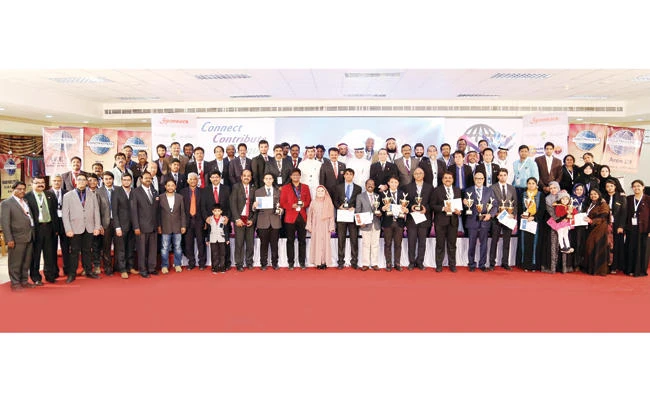 Organizers, guests, winners and participants pose for a group photo at the Toastmasters Division-L annual conference in Jubail. (AN photo)