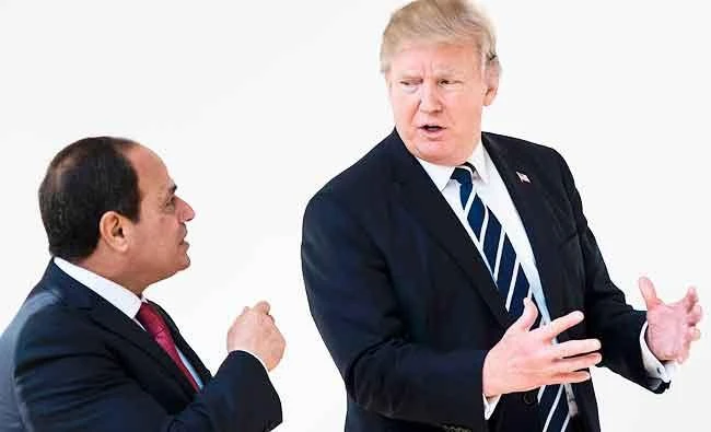 Egypt's President Abdel Fattah al-Sisi (L) and US President Donald Trump walk through the colonnade of the White House to a lunch after a meeting on Monday in Washington, DC. (AFP)