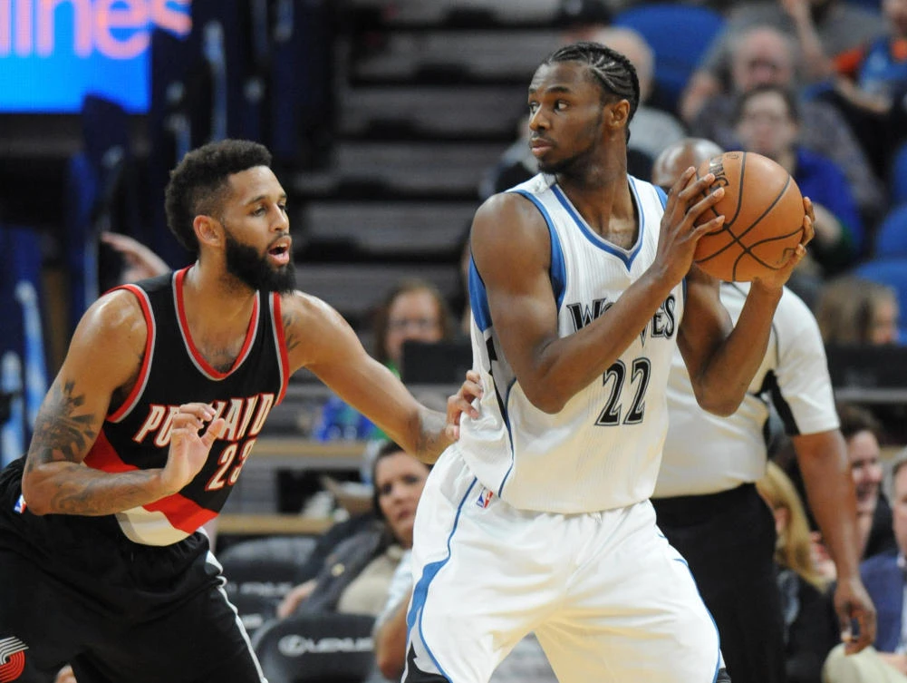 Minnesota Timberwolves forward Andrew Wiggins (22) looks to pass as Portland Trail Blazers guard Allen Crabbe (23) defends in the second half at Target Center on Monday night. (USA TODAY Sports)