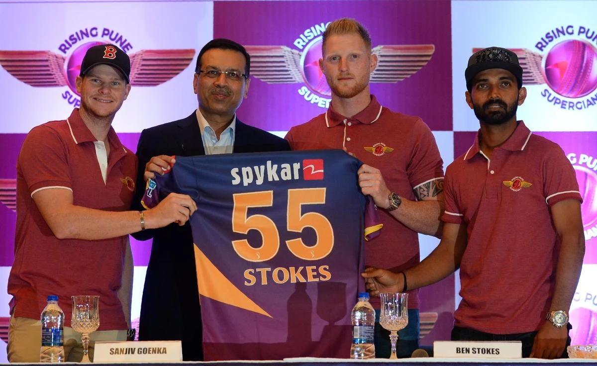 Rising Pune Supergiants team captain Steve Smith, left, team owner Sanjiv Goenka, second left, and Ajinkya Rahane, right, pose for a photograph with a team jersey as they welcome England's Ben Stokes, second left, to the team during a press conference in the Indian capital New Delhi on March 30. (AFP)