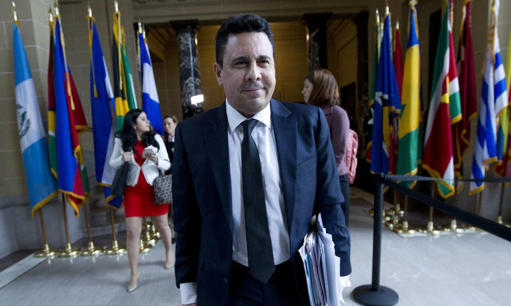 Alternate Representative of Venezuelan representative Samuel Moncada walks out of a meeting of the Permanent Council of the Organization of American States in Washington on Monday after a disagreement with the Council. (AP Photo/Jose Luis Magana)
