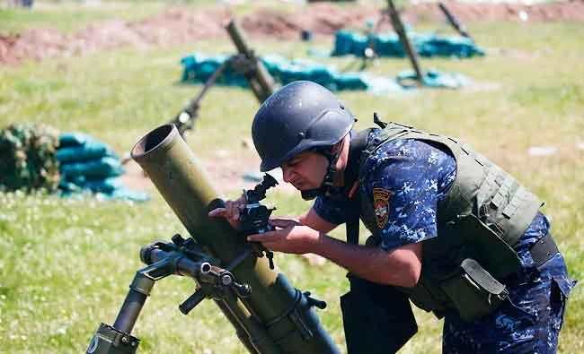 A member of the Iraqi forces adjusts a mortar launcher at a position in western Mosul on Tuesday, during an offensive to retake the city from IS jihadists. (AFP)