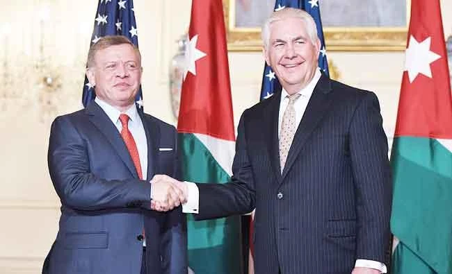 US Secretary of State Rex Tillerson (R) poses for a photo with Jordan's King Abdullah II ahead of a working lunch at the State Department in Washington, DC on Tuesday. (AFP)