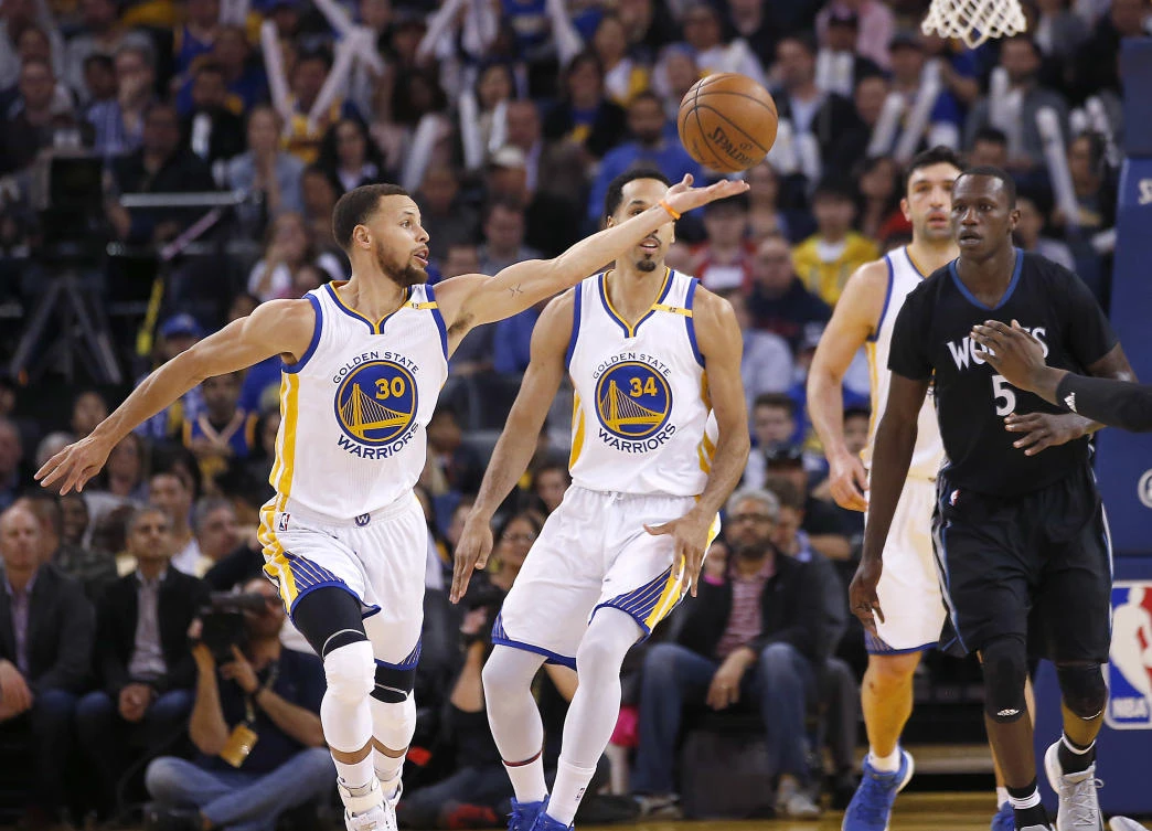 Golden State Warriors guard Stephen Curry (30) steals the ball from Minnesota Timberwolves forward Gorgui Dieng (5) during the second half of an NBA basketball game in Oakland on Tuesday night. (AP)