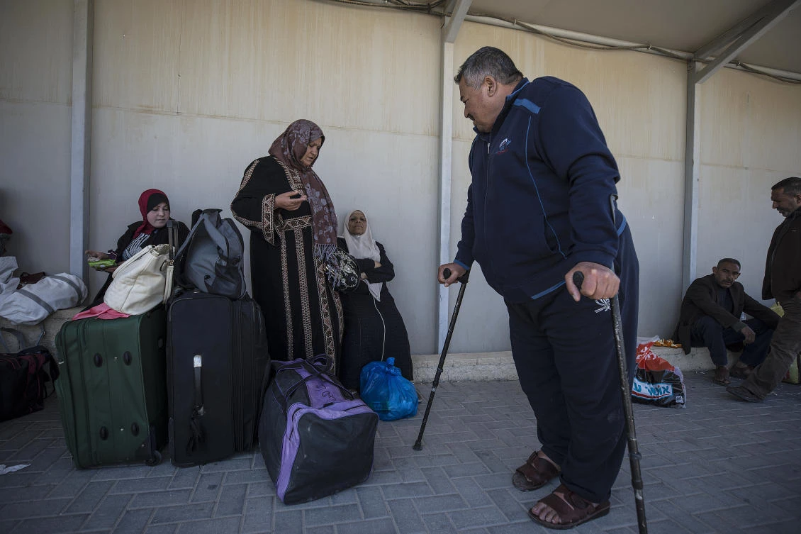 Palestinian residents of Gaza strip wait on the Israeli side of the Erez terminal to cross to Gaza Strip. Hamas imposed the lockdown and closed the Gaza side of the crossing in the wake of a mysterious killing of a senior Hamas commander last week.(AP Photo)