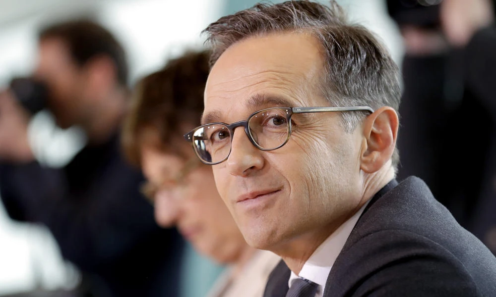 German Justice Minister Heiko Maas attends the weekly cabinet meeting at the chancellery in Berlin, Germany, on Wednesday. Germany's Cabinet has approved new rules to ensure that most marriages involving under-18s aren't legally recognized in the country. The issue arose following the influx of migrants to Germany in 2015, and the main aim is to protect girls who were married abroad. (AP Photo/Michael Sohn)