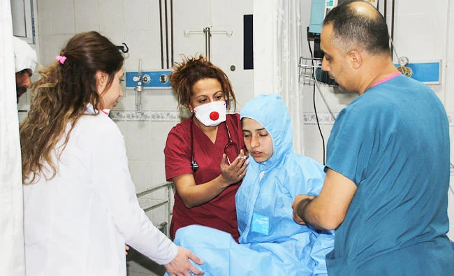 In this photo taken on late Tuesday, April 4, 2017 and made available on Wednesday, medics check a victim of alleged chemical weapons attacks in Syrian city of Idlib, at a local hospital in Reyhanli, Hatay, Turkey. (AP)