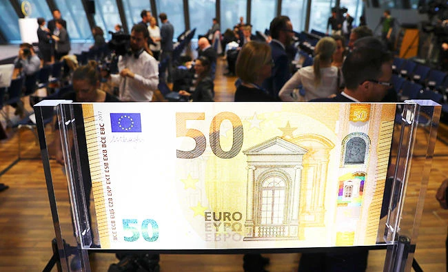 A huge specimen of the new 50 Euro banknote is pictured during a news conference at the ECB headquarters in Frankfurt, on Wednesday. (Reuters)