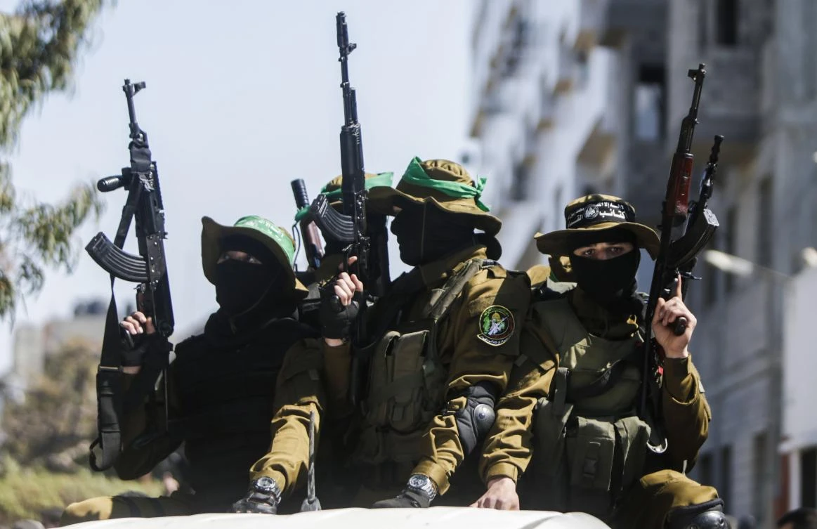 Members of the Ezzedine al-Qassam Brigades, the military wing of the Palestinian Islamist movement Hamas attend the funeral of Hamas official Mazen Faqha in Gaza city on March 25, 2017. (AFP)