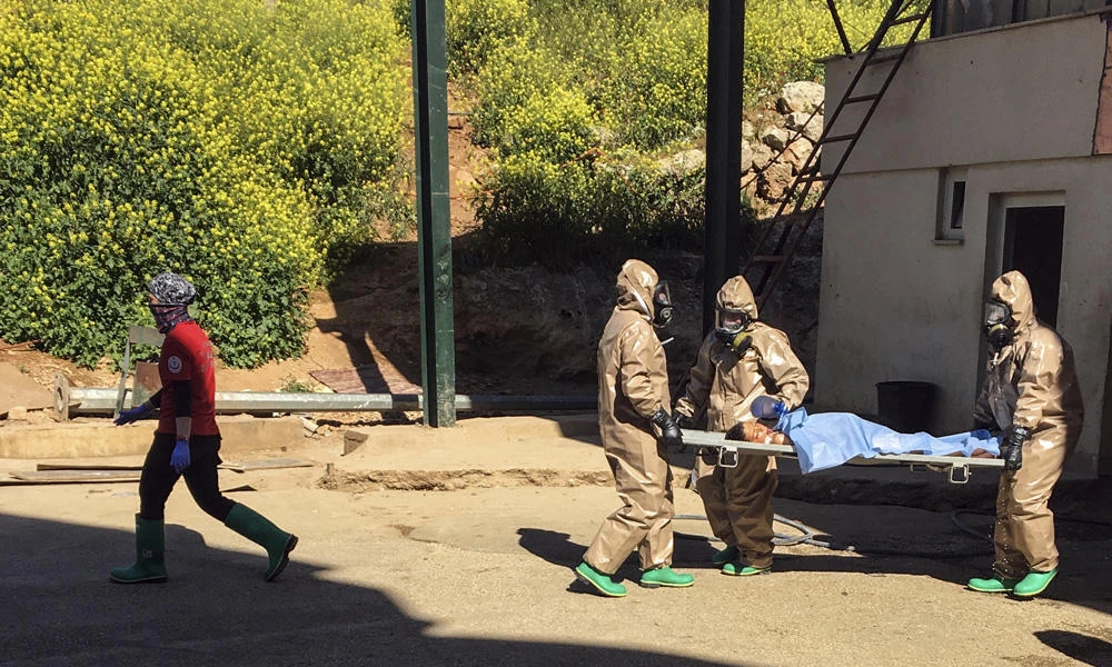 In this photo taken on April 4, 2017 and made available Wednesday, April 5, Turkish experts carry a victim of alleged chemical weapons attacks in Syrian city of Idlib, at a local hospital in Reyhanli, Hatay, Turkey. (AP Photo)