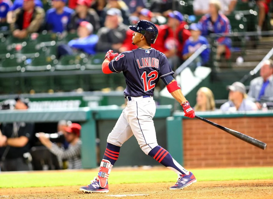 Francisco Lindor, of the Cleveland Indians, hits a grand slam in the ninth inning against the Texas Rangers at Globe Life Park in Arlington on Wednesday in Arlington, Texas. (AFP)