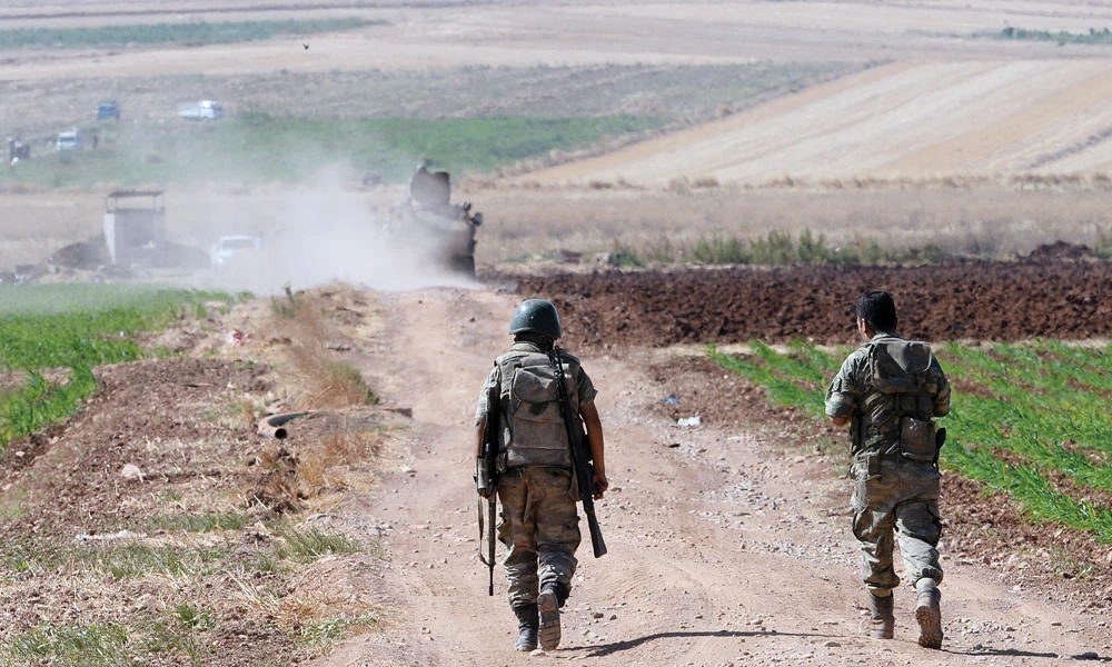 Turkish soldiers patrol near the border with Syria. (AP)
