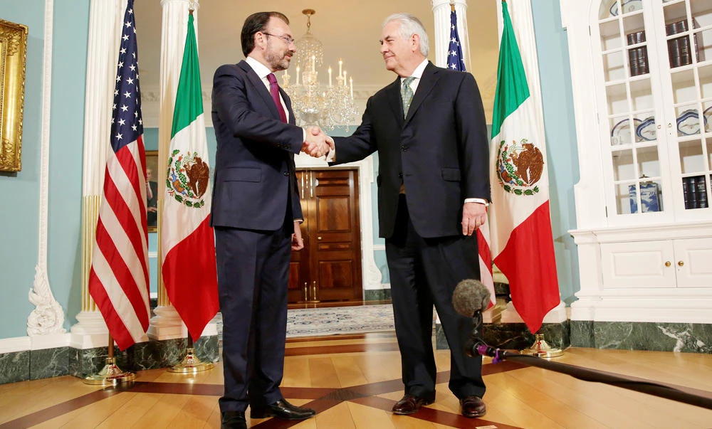 US Secretary of State Rex Tillerson, right, shakes hands with Mexican Foreign Minister Luis Videgaray at the State Department in Washington. (REUTERS)