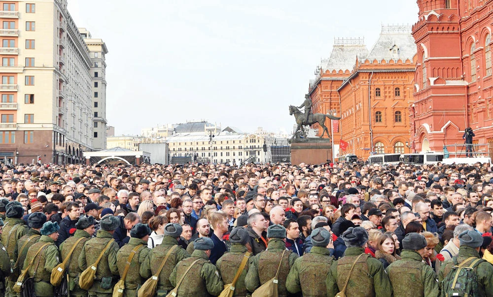People attend a rally honouring the victims of April 3 blast in the Saint Petersburg metro in central Moscow on Thursday. (AFP)