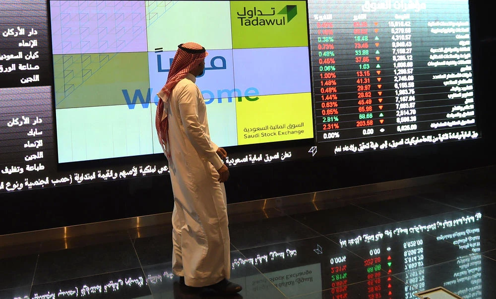 A Saudi investor monitors the stock exchange at the Saudi Stock Exchange, or Tadawul in Riyadh. (AFP file photo)