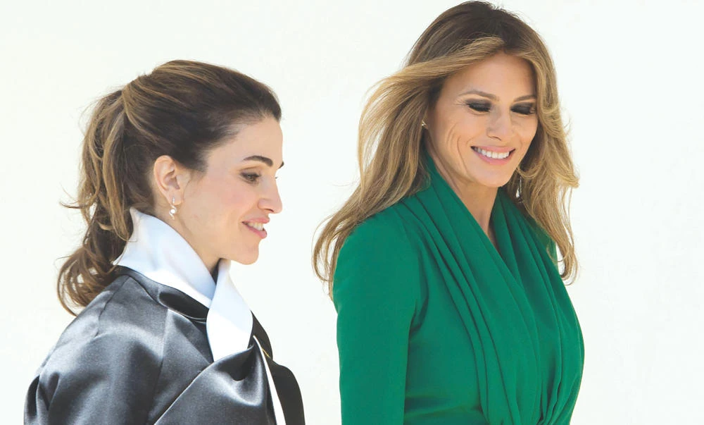 US first lady Melania Trump and Queen Rania of Jordan walk through the White House colonnade in Washington, DC, on Wednesday. (AFP)