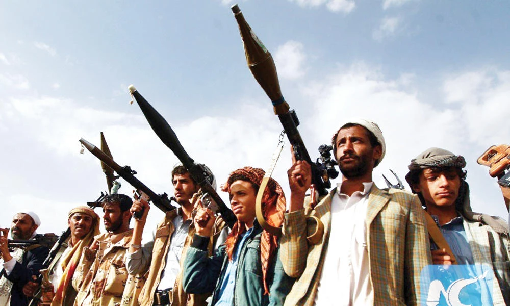 Iran-backed Houthi rebels brandish their weapons at a gathering in Sanaa in this file photo. (AFP)