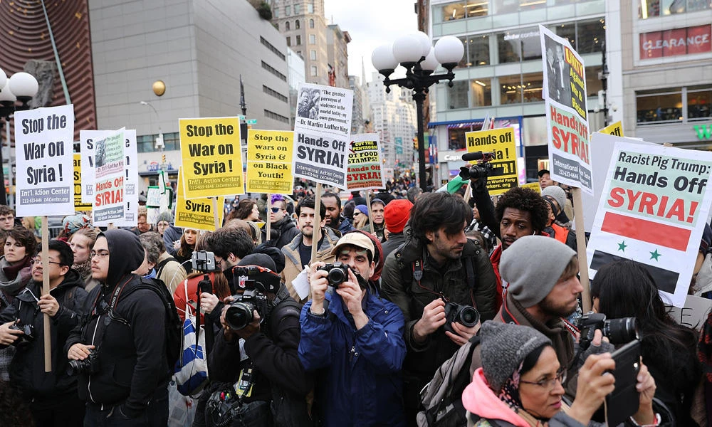 People participate in a protest against a recent American missile strike in Syria in Union Square on New York on Friday. Trump's far-right supporters have also denounced Trump's turn-around from his campaign statements against US intervention in foreign conflicts. (Spencer Platt/Getty Images/AFP)