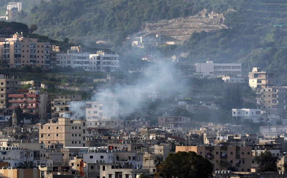 Smoke rises during clashes in Ain Al-Hilweh camp, Lebanon's largest Palestinian refugee camp, near the southern coastal city of Sidon. (AFP)