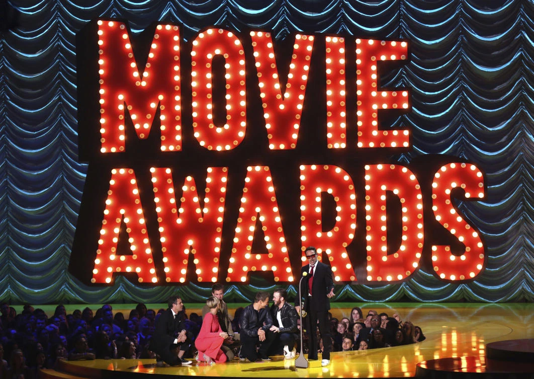 Mark Ruffalo, from left, Scarlett Johansson, Chris Hemsworth, Jeremy Renner, and Chris Evans present Robert Downey Jr. with the generation award at the MTV Movie Awards in Los Angeles.(AP)