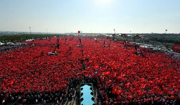Turkish people wave flags of their country as they take part in a Democracy and Martyrs' Rally in Istanbul, Sunday, Aug. 7, 2016. More than 1 million flag-waving Turks gathered in Istanbul on Sunday for an anti-coup rally to mark the end of nightly demonstrations since the July 15 abortive military insurrection that left more than 270 people dead. (AP)