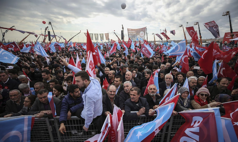 Supporters listen to Devlet Bahceli, the leader of Turkey's opposition Nationalist Movement Party, who supports President Recep Tayyip Erdogan, during a referendum rally in Istanbul on Sunday. Turkey is heading to a contentious April 16 referendum on constitutional reforms to expand Erdogan's powers. (AP Photo/Emrah Gurel)