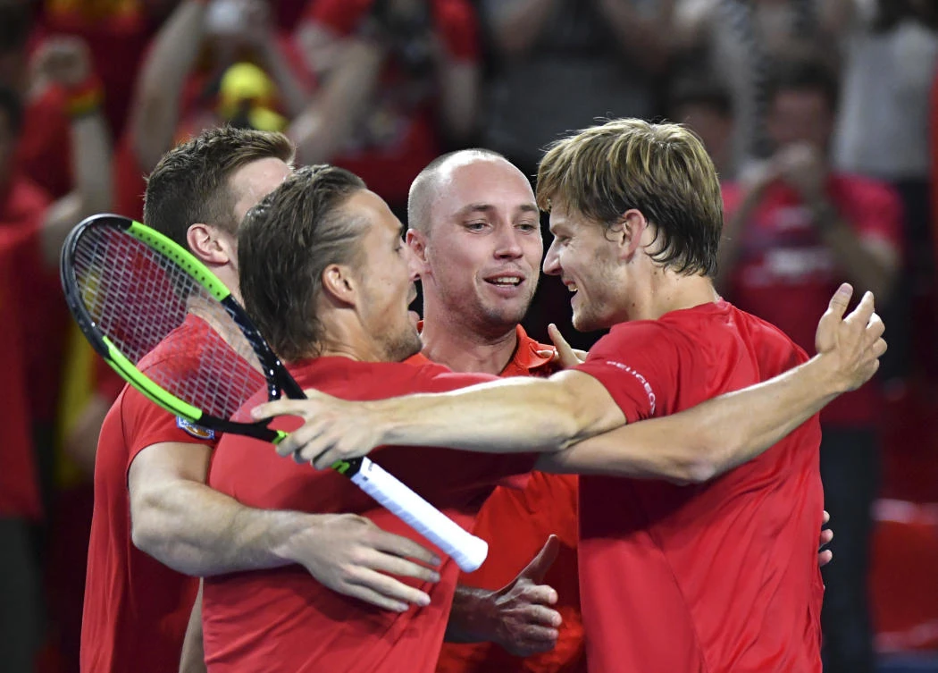 Belgium team members celebrate their victory over Italy in their Davis Cup World Group quarterfinal match at the Spiroudome de Charleroi stadium in Charleroi, Belgium, Sunday. (AP)